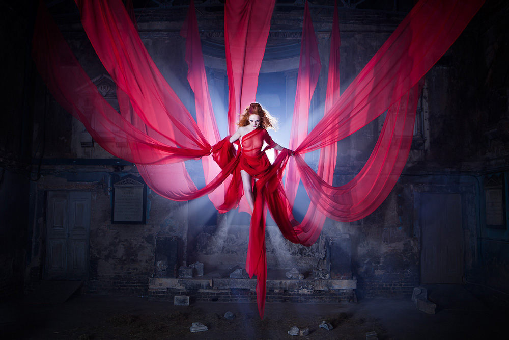 Red Siren redhead model Ivory Flame in flying harness, image by Ashley Cameron Photography