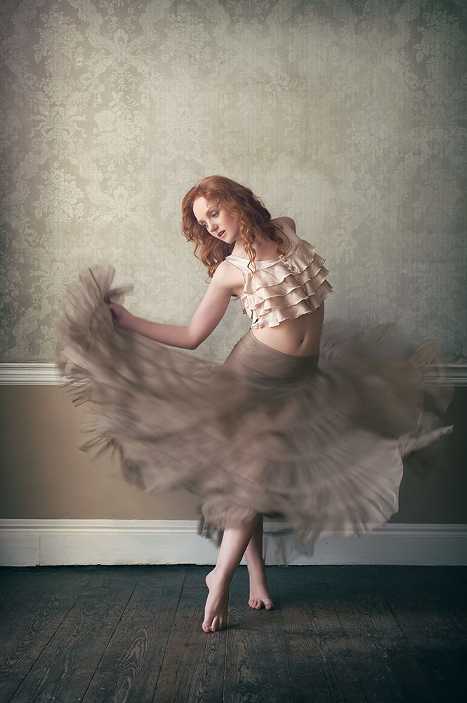 Red-haired model Ivory Flame dances with movement photographed by irish photographer Ciaran Whyte