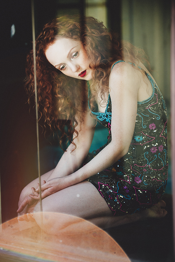 Red-haired model Ivory Flame portrait fashion by photographer Mike Stacey