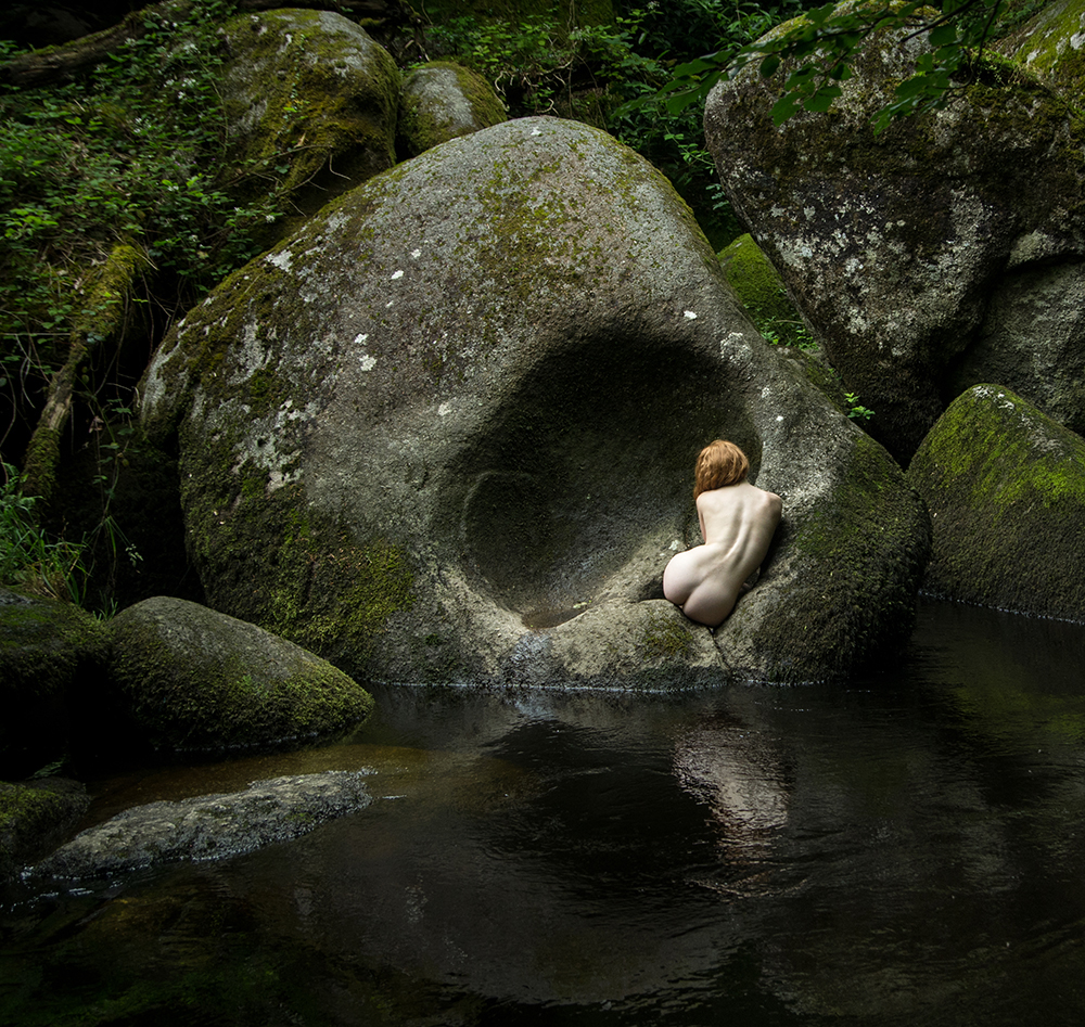 fine art nude model IVORY FLAME in rocks landscape by photographer Tim Pile