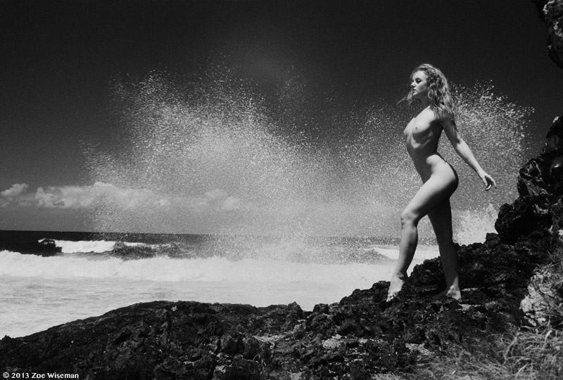 fine art nude model Ivory Flame in crashing waves by photographer Zoe Wiseman in Australia