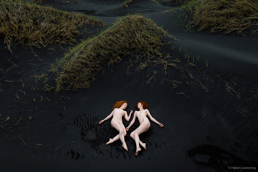 Art Nude Model Ivory Flame Svala Iceland by photographer Hakon Gronning in black sand dunes
